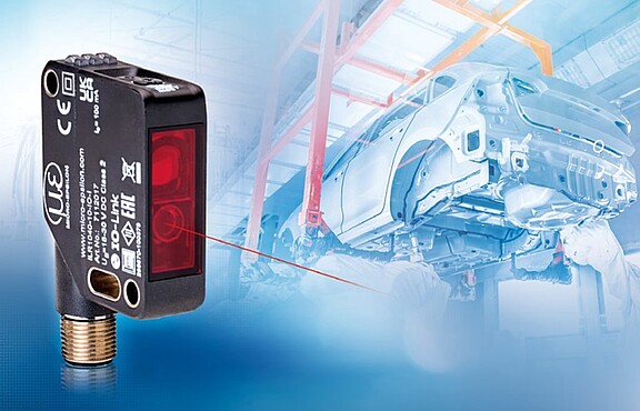 Sensor with image background of automotive production line